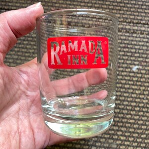 vintage 80s Ramada Inn small water or rocks glass with red screen print logo heavy bottom