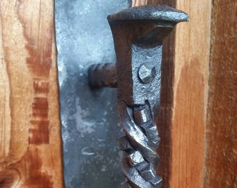 Hand forged railroad spike door pull