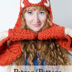Pode incluir: Uma mulher usando um chapéu de crochê de panda vermelho e uma echarpe combinando. O chapéu tem um rosto branco com olhos pretos e um nariz preto. O texto "Patron/Pattern Crochet!!!" está na parte inferior da imagem.