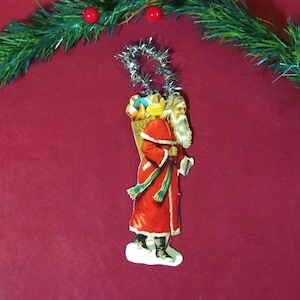 Antique Christmas Ornament Feather Tree Victorian  Die-Cut Santa Claus Red Robe Green Scarf & Toys Silver Tinsel Hanger Antique Christmas