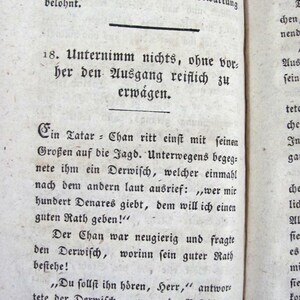 May include: An antique book page with black printed text in a German Fraktur typeface. The page is numbered 152 at the top and features a section starting with the number 18, followed by a narrative about a Tatar-Chan and a Dervish.