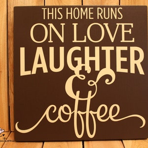 This home runs on love laughter and coffee hanging wood sign