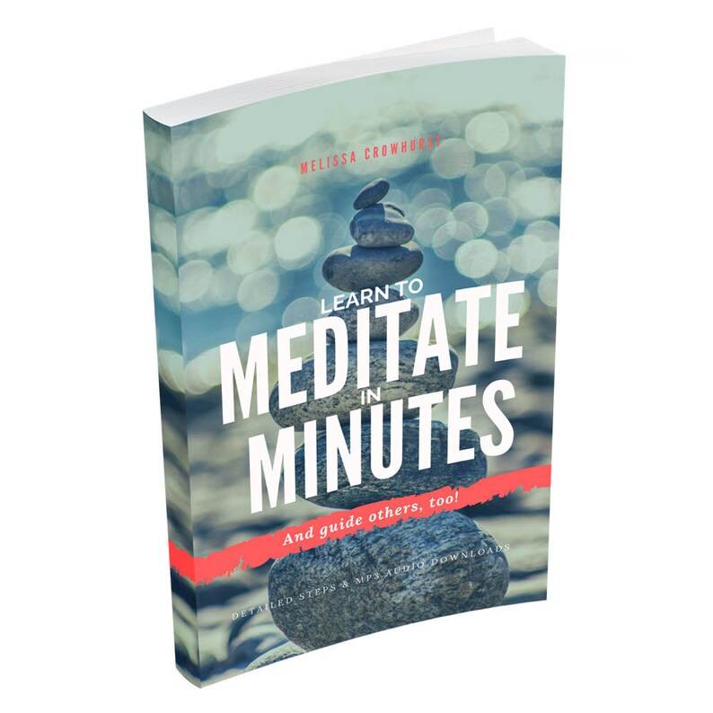 May include: A softcover book titled Learn to Meditate in Minutes by Melissa Crowhurst. The cover features a stack of grey stones against a blurred, light-filled background. The text is printed in white and red, including the subtitle And guide others, too! and the text Detailed steps & MP3 audio downloads.