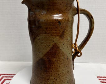 Vintage studio pottery stoneware pitcher jug carafe earthy brown tan drip glaze pinched spout natural cork stopper attached