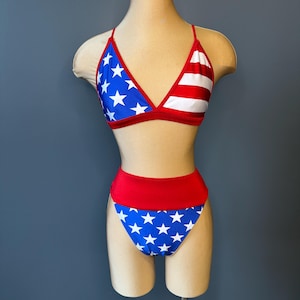 May include: A red, white and blue bikini with a star pattern. The top is a triangle style and the bottom is a high-waisted style.
