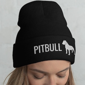 May include: Black beanie with a white embroidered pitbull silhouette and the word "PITBULL" on the front.