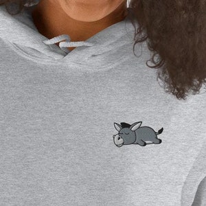 May include: A gray hoodie with a small embroidered cartoon donkey sleeping on the left chest.