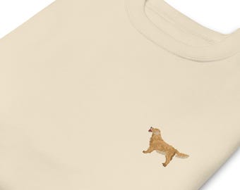 May include: A cream colored sweatshirt with an embroidered golden retriever dog on the front.
