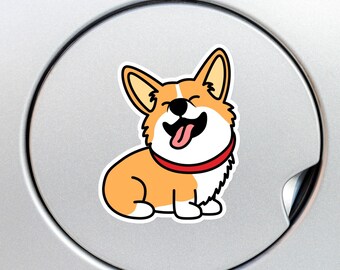May include: A vinyl sticker featuring a cartoon illustration of a tan and white Corgi dog with a red collar. The dog has large pointed ears, a black nose, and a wide, happy expression with its tongue hanging out, rendered in a flat style.