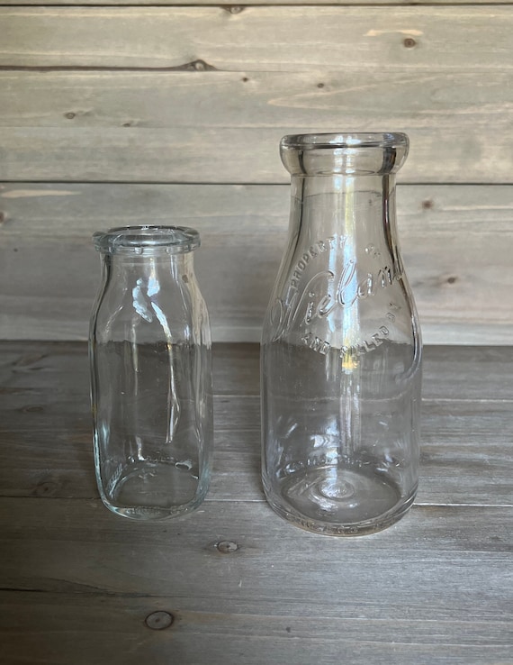 vintage cream or milk bottles, old half-pint bottle w/ wire bail glass lids