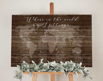 May include: A wooden sign with a world map printed on it. The sign has the text "Where in the world am I sitting?" and lists names of guests under different countries. The sign is on a wooden easel.