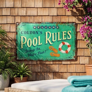 May include: A vintage-style metal sign with the text "Colton's Pool Rules" in white and yellow lettering on a teal background. The sign includes images of flip-flops and a life preserver. The sign is mounted on a wooden wall.