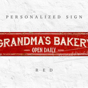 May include: Red metal sign with a distressed look, featuring the text "Grandma's Bakery - Open Daily".