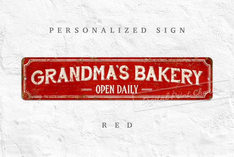 May include: Red metal sign with a distressed look, featuring the text "Grandma's Bakery - Open Daily".