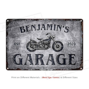 May include: A distressed metal sign with a vintage motorcycle design. The sign reads "Benjamin's Garage" with the dates "EST. 2020".