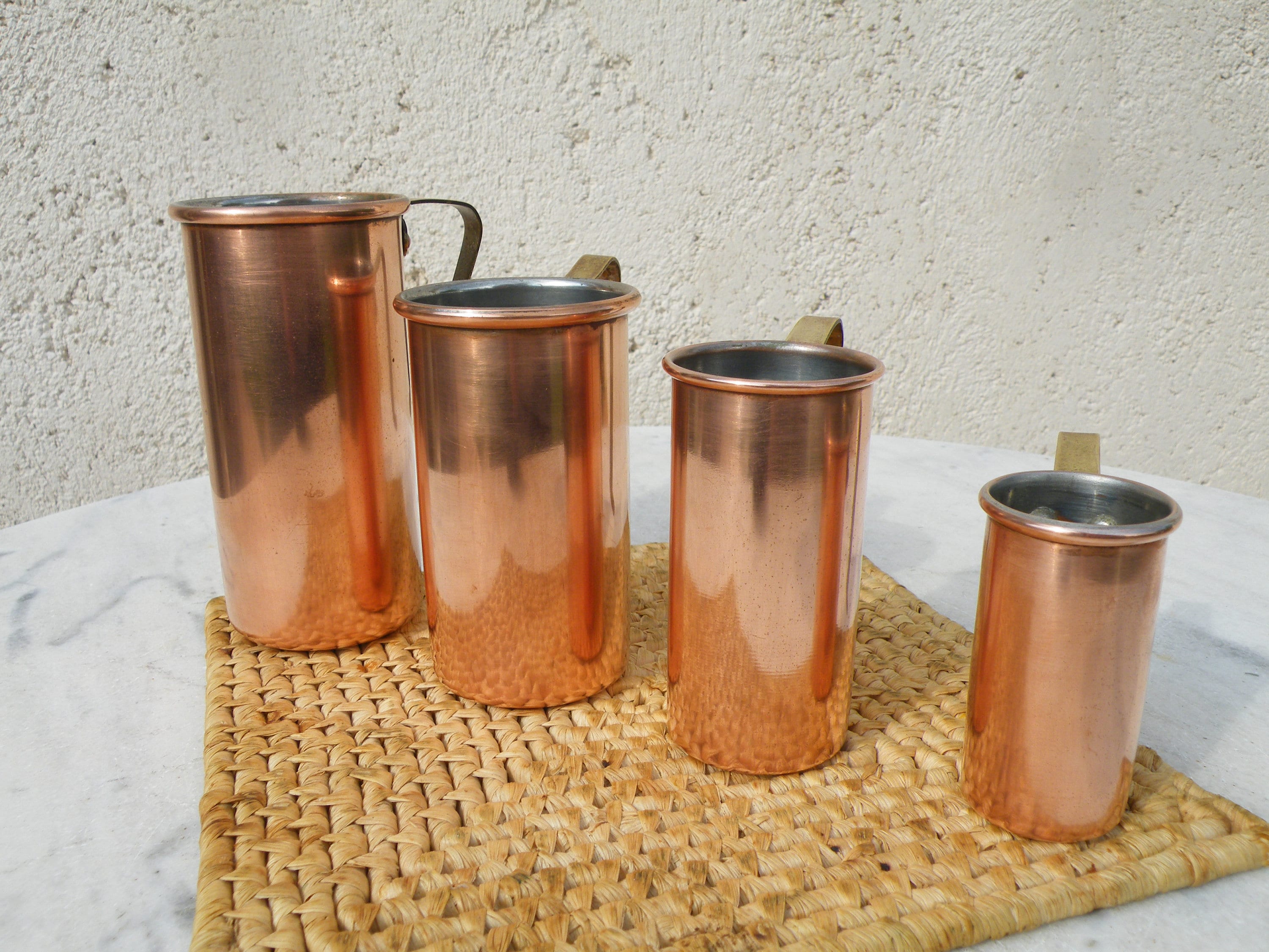 vintage copper measuring cups, set graduated measures or bar