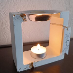 White and gold square incense burner.