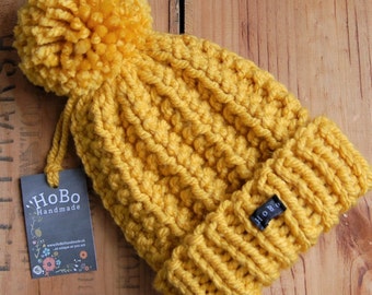Mustard Bobble Hat. Womens or mens thick chunky knit yellow pom pom beanie, hand knitted in easy care acrylic yarn extra large removable pom