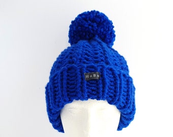 Royal Blue Bobble Hat. Thick chunky knit beanie hat hand knitted in easy care acrylic yarn with an extra large detachable pom pom