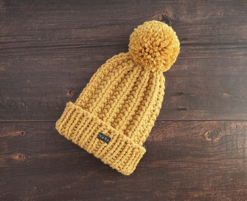 Yellow HoBo Handmade 'Lofty' Bobble Hat. Thick chunky hand knitted beanie with large removable pom pom. Wool blend. Available in 3 colours image 3