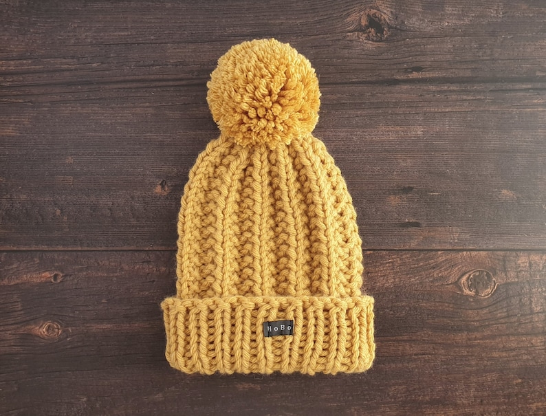 Yellow HoBo Handmade 'Lofty' Bobble Hat. Thick chunky hand knitted beanie with large removable pom pom. Wool blend. Available in 3 colours image 1
