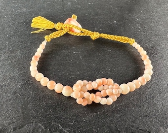 Pulsera Haorihimo de seda coral piel de ángel