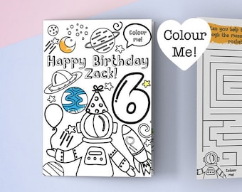 May include: A printable coloring page card with a space theme. The card features a rocket, planets, stars, and an astronaut. The card says "Happy Birthday Zack!" and has the number "6" on it. The card also includes a maze for kids to color and solve.