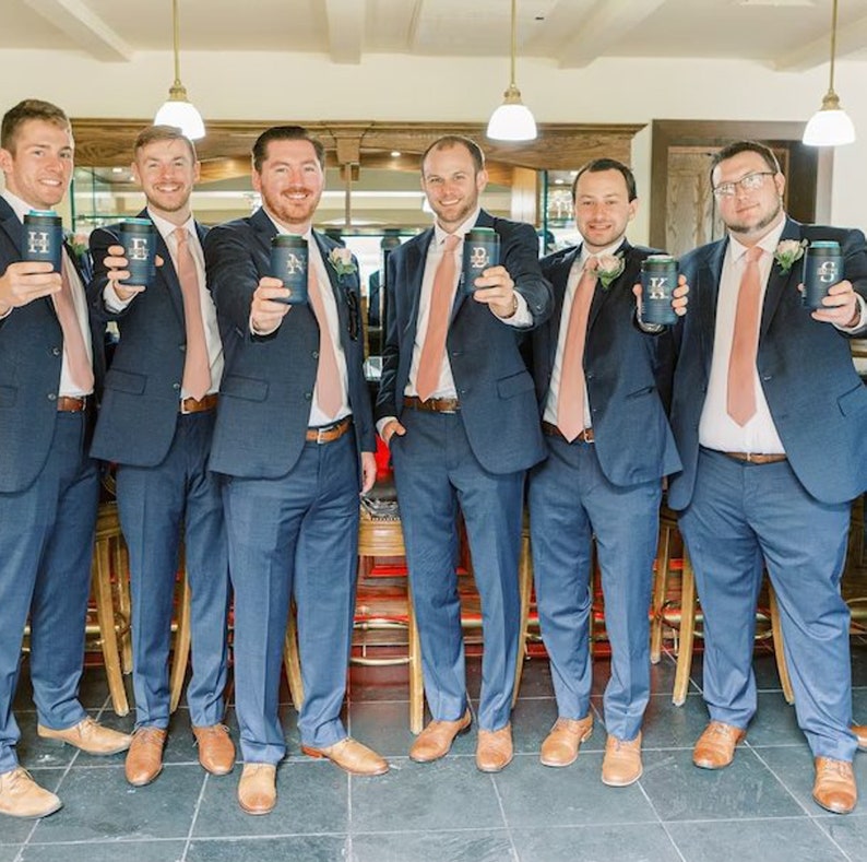 Groomsman Holding Custom Beer Can Coolers