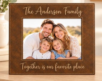 May include: A rectangular brown faux leather picture frame with white stitching. The top text reads The Anderson Family and the bottom text reads Together is our favorite place. A photograph of a family of four is displayed inside.