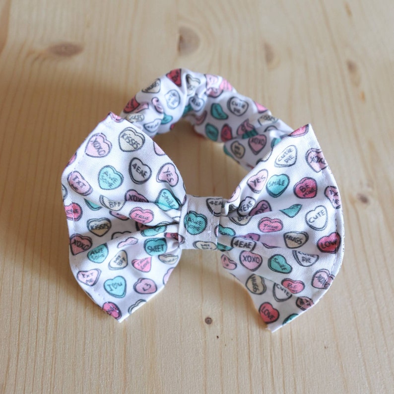 Set of two hair elastics with SweetHeart Candy-themed bow