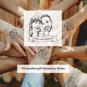 May include: Black and white temporary tattoos featuring a couple's caricature with the text "Bottoms up Butters!" and "Personalize gift Temporary Tattoo". The image shows multiple hands with the tattoos.