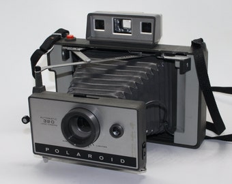 Polaroid Land Camera Automatic 320 Instant Camera with new battery, manual and flash c.1969 – Good condition & rare