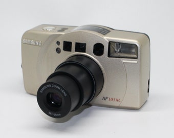 Samsung Fino 105xl 35mm Film Compact Camera with 38-105mm lens with case - Very good condition and tested - 2000 Limited Edition Sticker