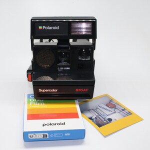 Polaroid Supercolor 670 AF Instant Camera With New Box of Polaroid
