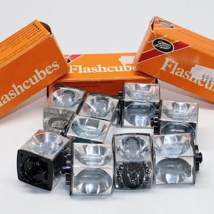 May include: A handmade wooden sign with the text "Welcome to our home" in a handwritten style. The sign is painted white with black lettering and a distressed finish, suitable for indoor or outdoor use.