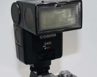 Flash Cobra D400 vintage para cámara réflex Olympus de 35 mm (con filtros de color)