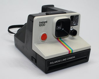 Polaroid Instant 1000 Land Camera with brand-new film, manual, flash bar and carry case – Tested and working - Very good condition