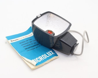 Ferrania Microlux-flitser: vintage cameraaccessoire uit de jaren 60 met doos