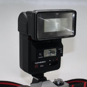 Flash elettronico Hanimex TZ3600 per fotocamere reflex vintage da 35 mm – Ottime condizioni e testato