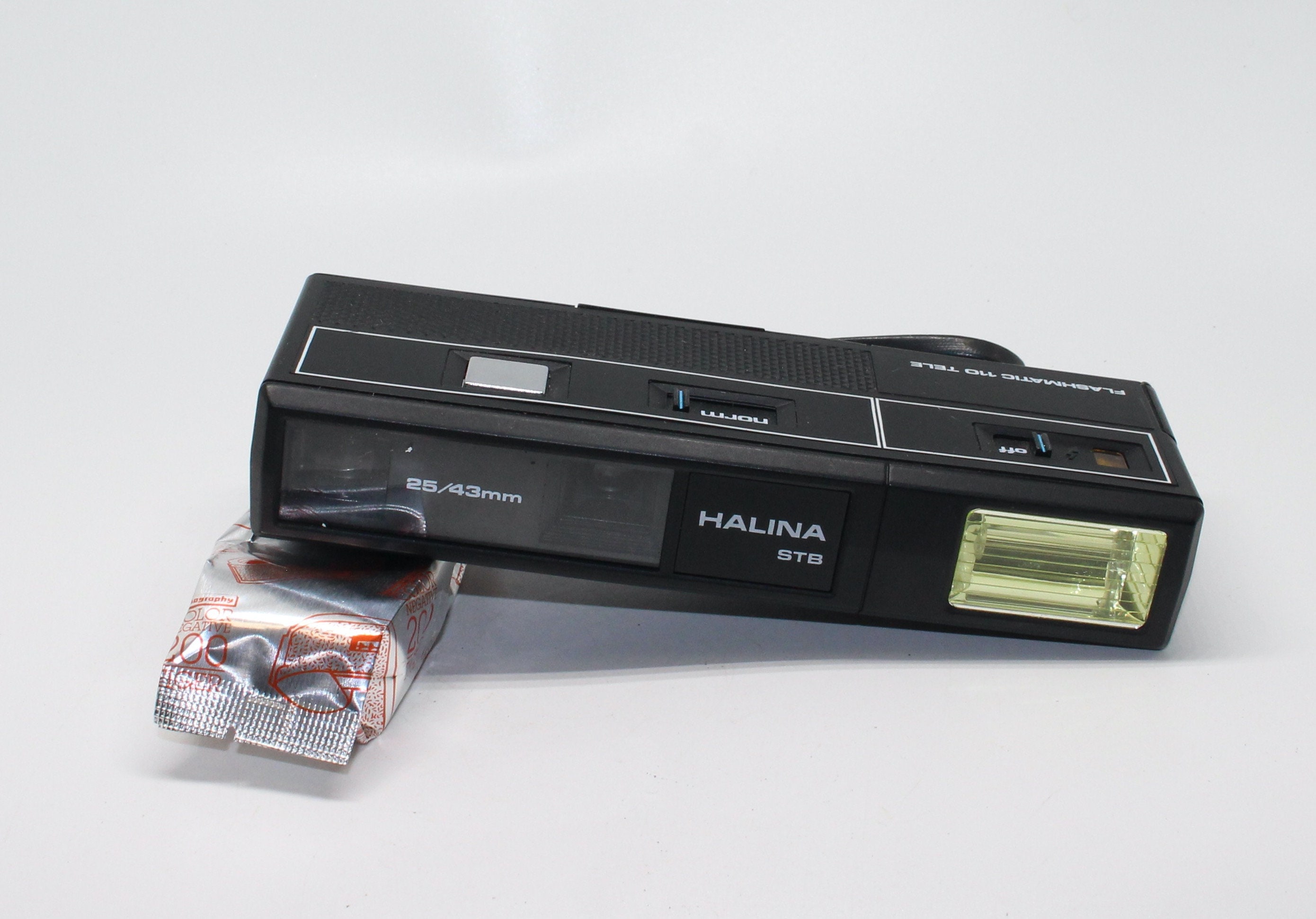 Cámara de película Halina Flashmatic 110 Tele STB Sub Mini 110