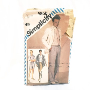May include: A Simplicity sewing pattern envelope, number 5866, featuring a design by Henry Grethel. The beige paper envelope displays illustrations of a blazer, trousers, and a shirt, with text indicating a waist size of 39 inches and a price of $4.00.