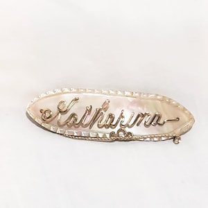 May include: A rustic wooden sign with the text "Welcome to our home" in white lettering. The sign features a distressed finish and a simple, inviting design, perfect for a front porch or entryway.