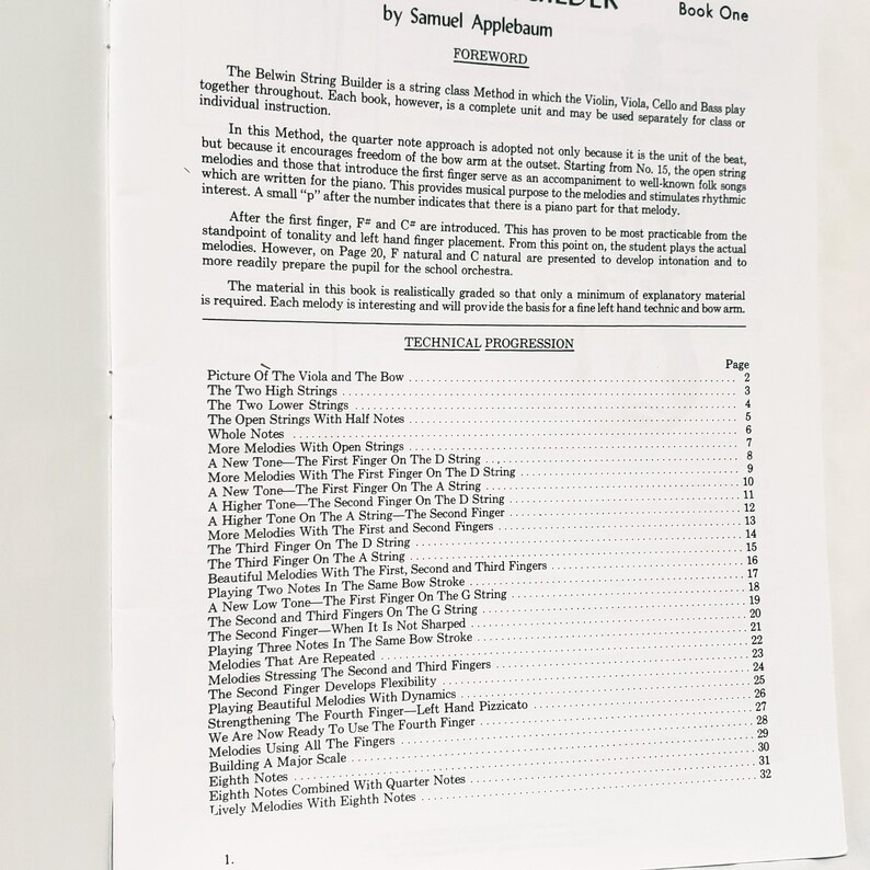 May include: A white page from the music instruction book Belwin String Builder Book One by Samuel Applebaum. The page contains a foreword explaining the string class method and a detailed technical progression table listing lessons from page 2 to 32.
