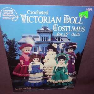 May include: Crocheted Victorian Doll Costumes for 15" dolls. The cover of a crochet pattern book features five dolls wearing different Victorian-era outfits. The dolls are standing in front of a house.