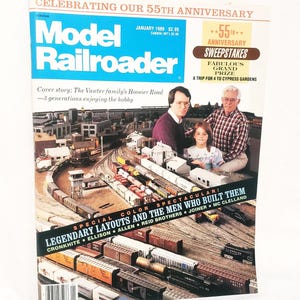 May include: The cover of the January 1989 issue of Model Railroader magazine. The cover features a family posing in front of a model train layout. The magazine celebrates its 55th anniversary and features a sweepstakes.