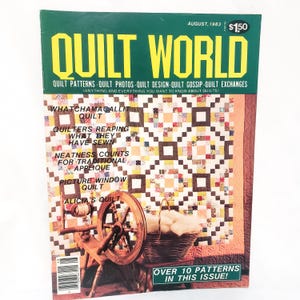 May include: A vintage August 1983 issue of Quilt World magazine. The cover features a colorful quilt design with a spinning wheel and basket of yarn. Text includes "Quilt Patterns" and "Over 10 Patterns in this Issue!"