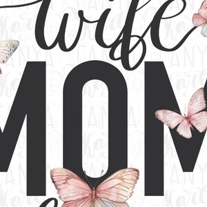 May include: Black and white graphic text that reads "Wife Mom" with pink butterflies surrounding the text.