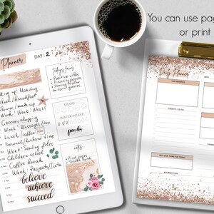 May include: A digital daily planner displayed on a tablet and a printed version on a clipboard. The planner features a schedule, to-do list, and mood tracker. The text "You can use pages digitally or print them" is visible.