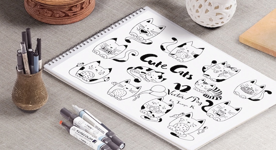 Set of cute funny cat heads in doodle style. Vector hand drawn