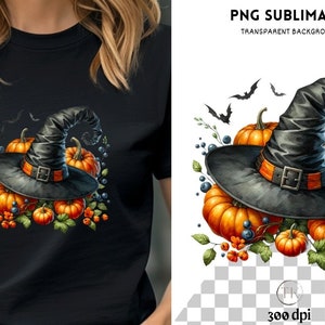 May include: Black t-shirt featuring a Halloween design. The design includes a black witch hat with an orange band, pumpkins, and bats. The hat sits atop orange pumpkins with green leaves and berries. The words "PNG SUBLIMATION" are at the top.